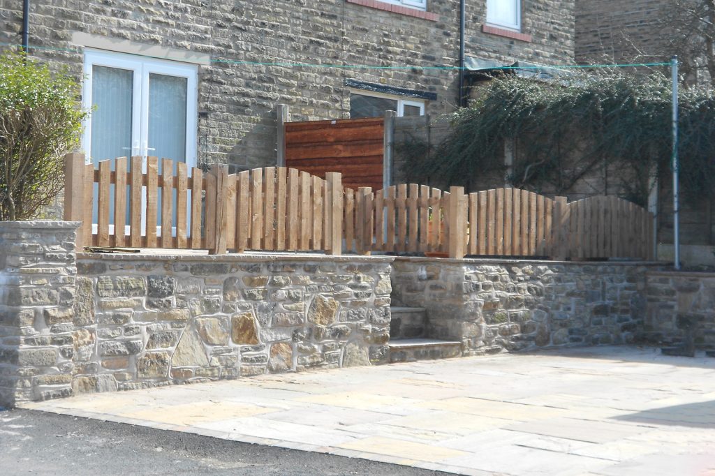 Natural stone wall and driveway