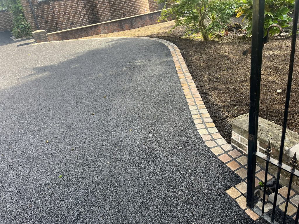 Sweeping tarmac driveway