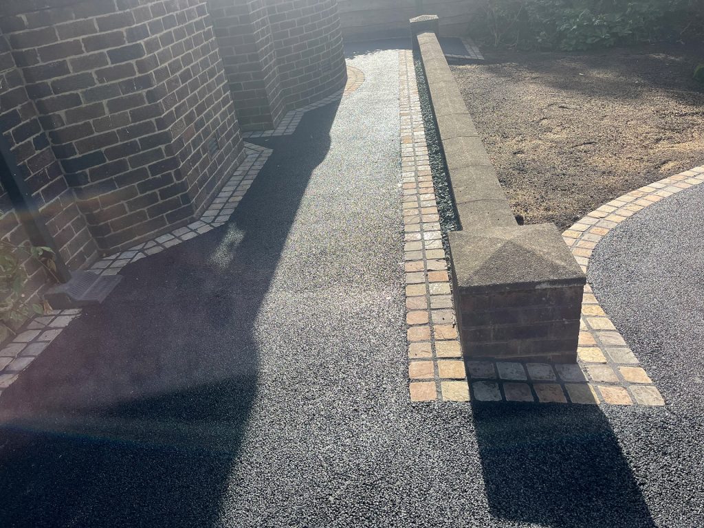Tarmac pathway along front of house