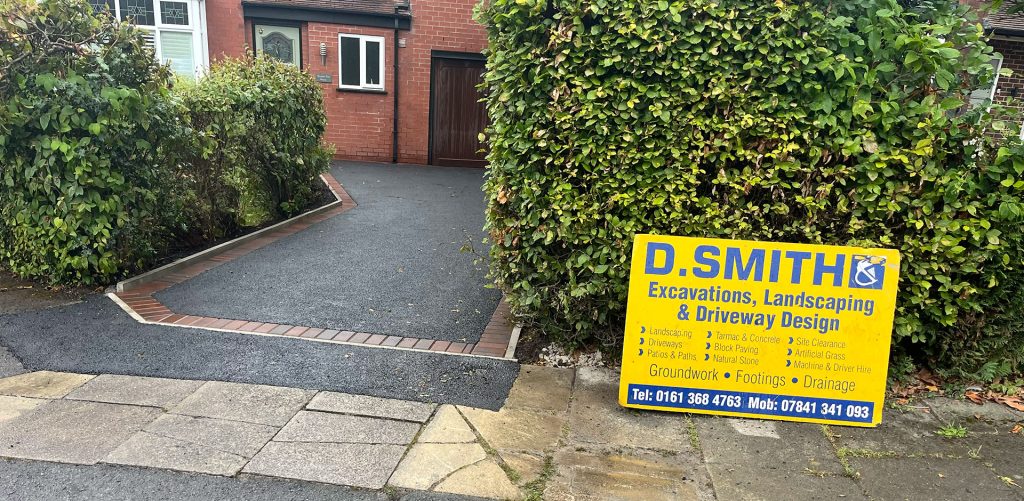 Tarmac driveway with red brick border, Romiley