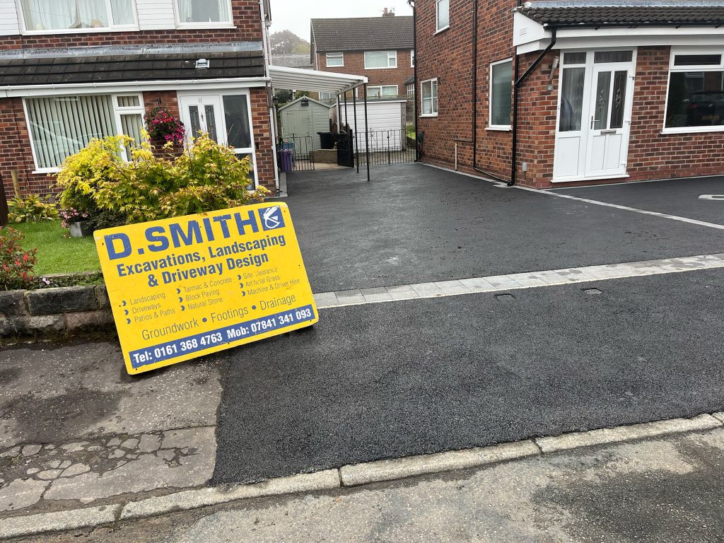 Tarmac driveway frontage for to houses with block paved border