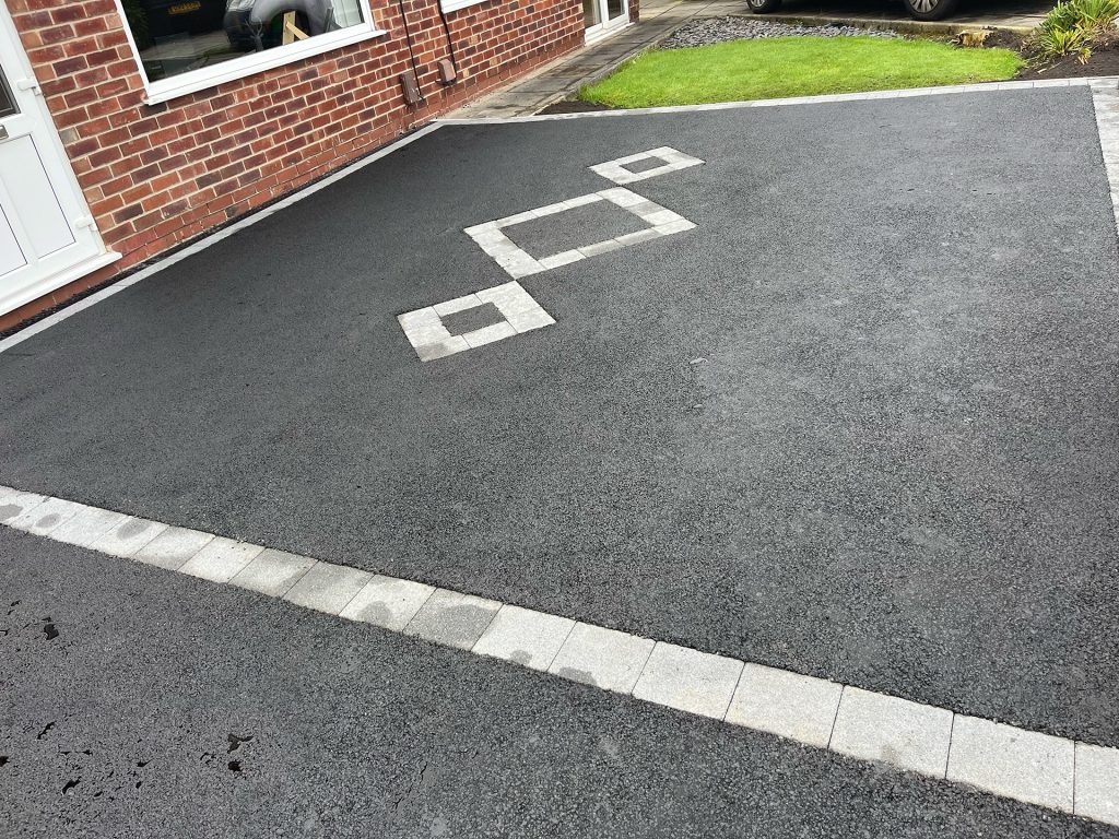 Tarmac driveway including diamond block paved feature