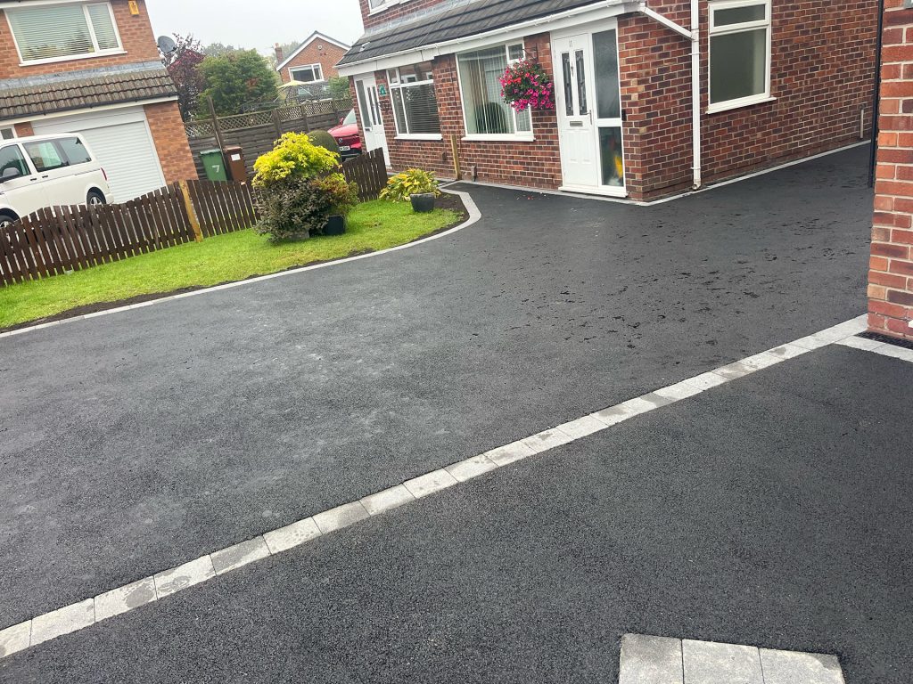 Tarmac driveway and pathway along front of the house