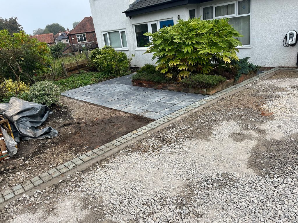 Newly laid Ebony Indian stone pathway and drive prepared ready for tarmac