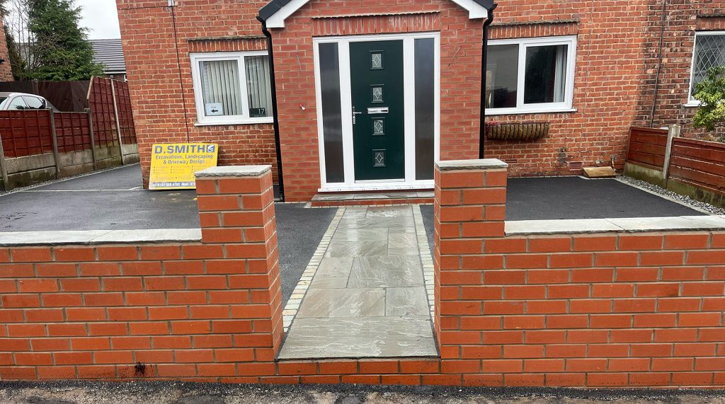 Red brick boundary wall and entrance in preparation for gates