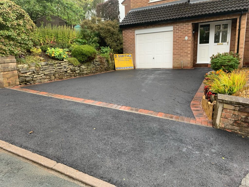 Tarmac driveway frontage with a block paved border