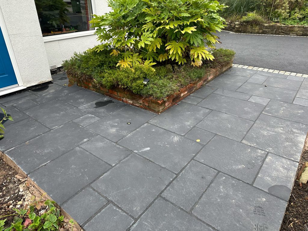 Ebony Indian stone pathways enhancing home frontage