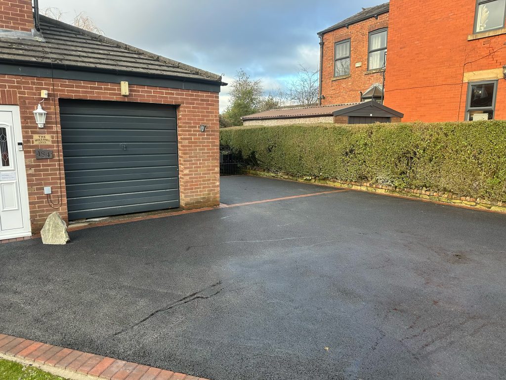 New tarmac driveway with block paved border. Dukinfield, Tameside