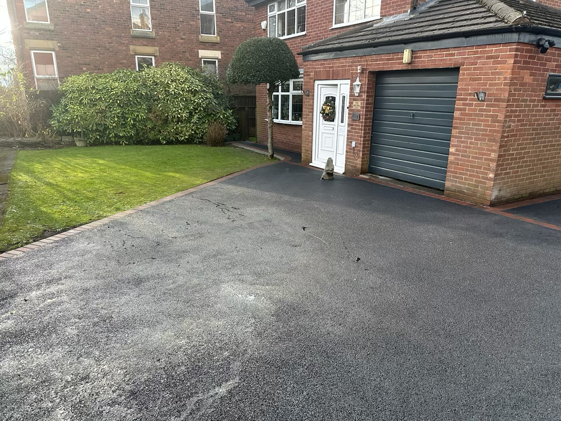 New tarmac driveway and entrance with block paved border New tarmac driveway and entrance with block paved border